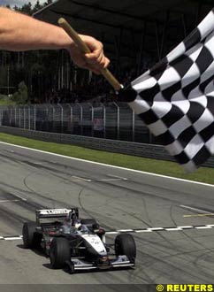 Hakkinen takes the checkered flag