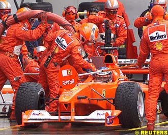 Michael Schumacher pits for rain tyres