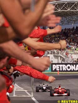 Schumacher takes the chequered flag