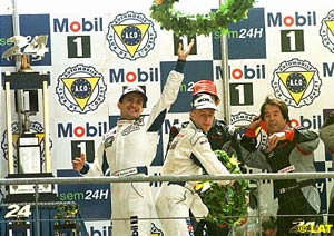 McNish, Stephane Ortelli and Laurent Aiello (Porsche) after finishing in 1st at the 98 Le Mans