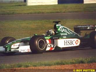Eddie Irvine driving the Jaguar near dusk