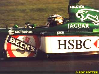 Eddie Irvine driving the Jaguar near dusk