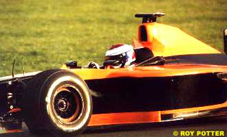 Jos Verstappen driving his Arrows near dusk