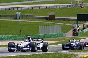 Juan Pablo Montoya leading teammate Ralf Schumacher in early parts of the race