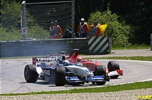 Juan Pablo Montoya forcing Michael Schumacher wide