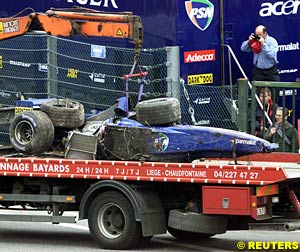 The wreckage of Luciano Burti's Prost AP04 on it's way back to the garage