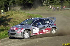 Marcus Gronholm sprays some gravel