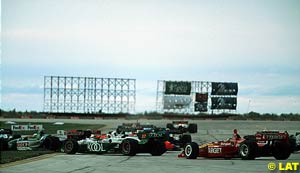 Chaos at turn 1, with Franchitti heading for the grass