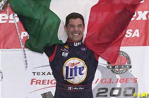 Max Papis shows his true colours on the podium in Portland