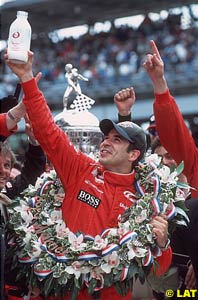 Winner Castroneves with the famous bottle of milk