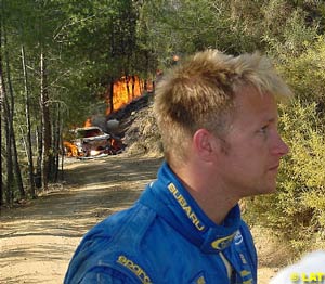 Solberg walks away from his burning Impreza