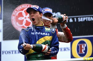 Winner Ricardo Sperafico is drowned in champagne by 2001 Formula 3000 champion Justin Wilson