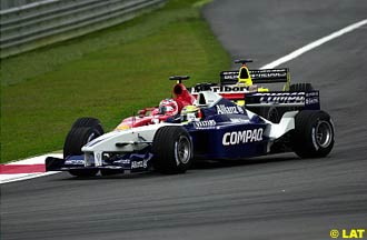 Barrichello sandwiched between Ralf and Trulli