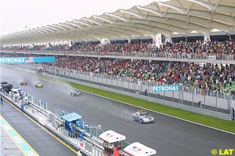The safety car comes out as it rains in Sepang