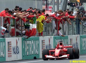 Schumacher takes the checkered flag