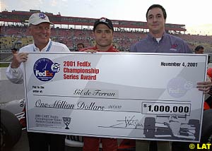 Gil de Ferran receives a rather large cheque