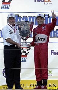 Roger Penske and Gil de Ferran with their prize, the Vanderbilt Cup