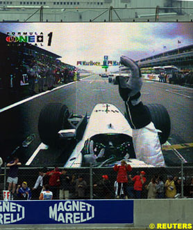 Coulthard seen on the large screen when he stalled on the grid
