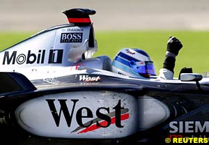 Mika Hakkinen on his way to parc ferme  