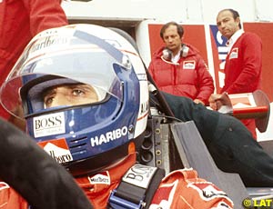 Ron Dennis and Jo Ramirez standing behind Prost's car, 1984