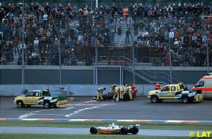 Doctors work on Zanardi, legs shattered but still in his car