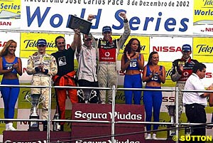 The race two podium of second place finisher Antonio Garcia, winner Justin Wilson and third place finisher Franck Montagny