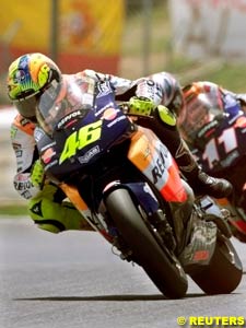 Valentino Rossi just holds off his teammate Tohru Ukawa