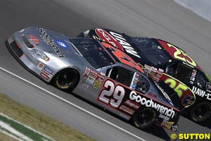 Winner Kevin Harvick battles with Joe Nemechek