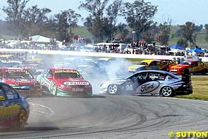 Turn one, race one, mayhem as Craig Lowndes spins