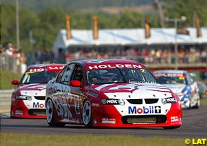 A rare sight as Jason Bright leads teammate Mark Skaife