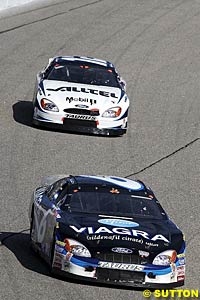 Second place finisher Mark Martin runs ahead of polesitter Ryan Newman