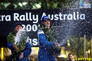 Timo Rautiainen and Marcus Gronholm celebrate in Australia