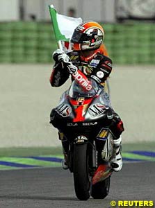 Marco Melandri celebrates after taking his final 250cc win at Valencia