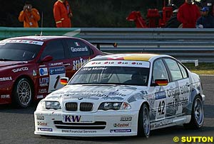 Series runner-up and race two winner Jorg Muller slides up the inside of series champion and race one winner Fabrizio Giovanardi