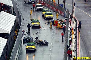 The wreckage strewn across the pit straight after the first start crash