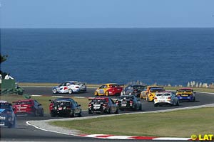 The field winds its way from Honda hairpin to Siberia, Bass Strait in the background