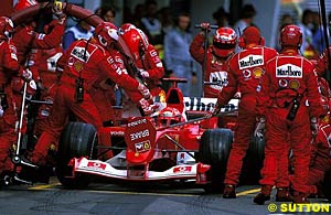 Fire emerges from Schumacher's Ferrari