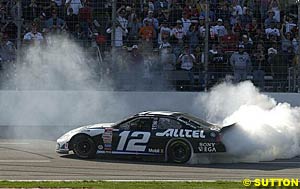 Ryan Newman smokes 'em up as he completes some victory donuts