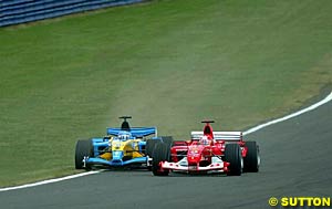 Schumacher squeezes Alonso