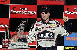 Jimmie Johnson with the winner's trophy at New Hampshire