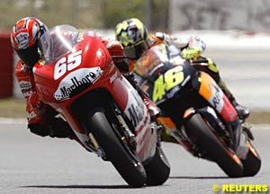 Winner Loris Capirossi leads Valentino Rossi