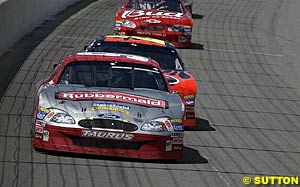 Winner Kurt Busch leads Jeff Gordon and Dale Earnhardt Jr during the race