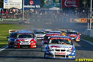 Greg Murphy leads Steven Richards at the start of race one, as Mark Skaife holds out Marcos Ambrose