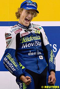 Winner Sete Gibernau jubilant on the podium