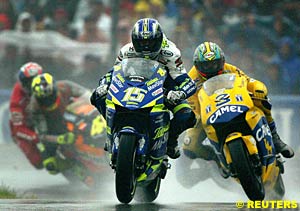 Winner Sete Gibernau leads second place finisher Max Biaggi through the chicane early in the race as Valentino Rossi fights with Troy Bayliss in the background