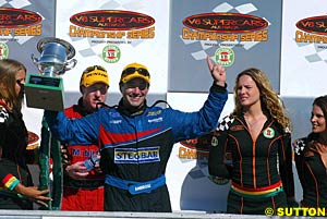 Marcos Ambrose celebrates four from four as worn out Mark Skaife looks on