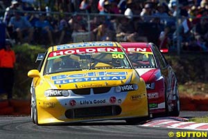 Points leader Jason Bright feels the heat from Mark Skaife in race three