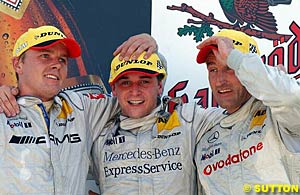The all Mercedes podium of second place finisher Marcel Fassler, winner Christijan Albers and third place finisher Bernd Schneider