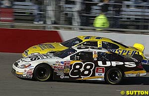 Winner Dale Jarrett races alongside polesitter Dave Blaney