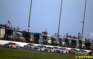 Kevin Harvick leads the field down the backstretch early in the race